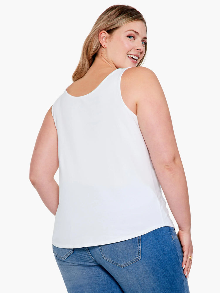 White scoop-neck tank top with a curved shirttail hem, shown on a model from the back.