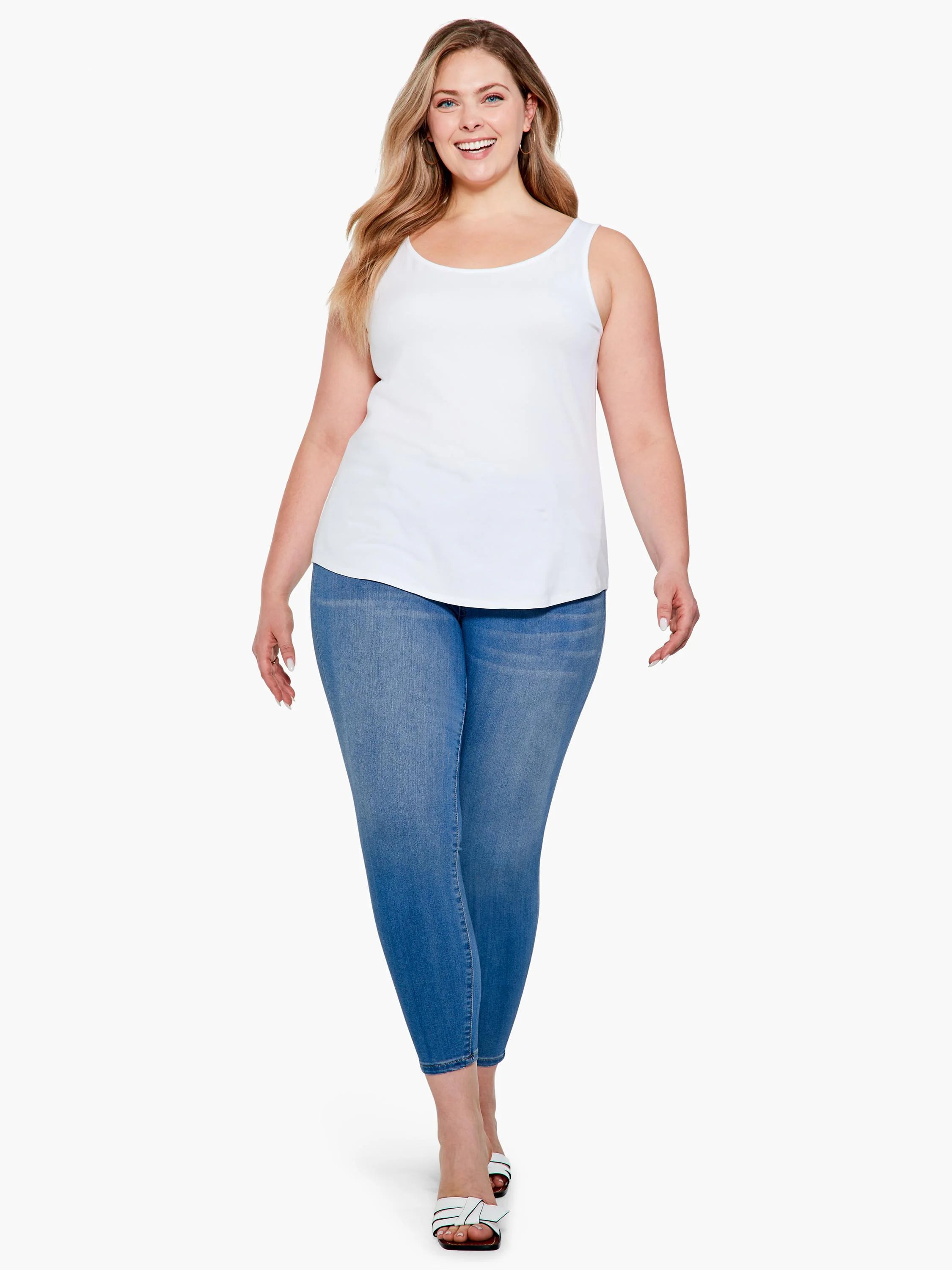 White scoop neck tank top with a curved shirt-tail hem.