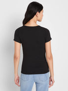Black, fitted, ribbed short sleeve crew neck tee on model, viewed from back.