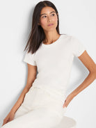 Off-white, ribbed, short-sleeve crew neck tee, fitted on a model.