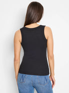 Black ribbed knit tank top. Fitted, with a rounded back neckline.