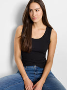 Black, ribbed knit scoop neck tank top; close-fitting.