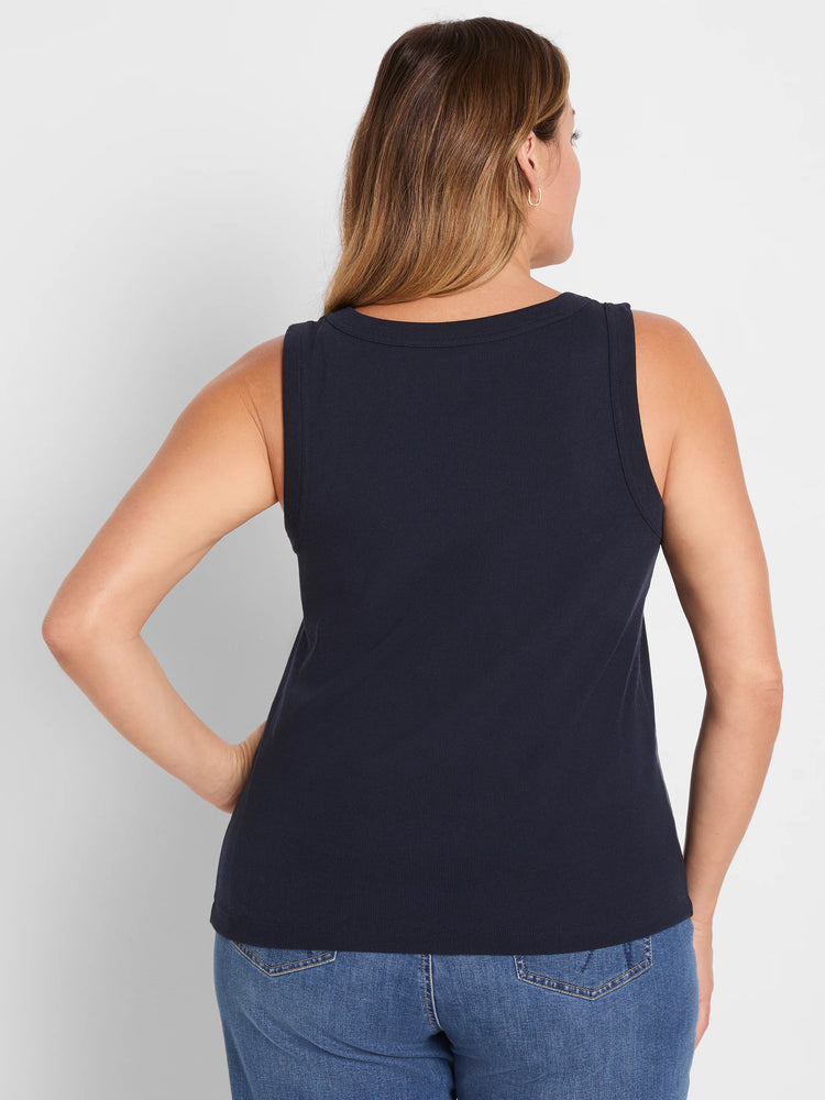 Dark navy rib-knit scoop tank, seen from the back on a model. Features a gentle scoop neckline and vertical ribbing.
