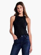 Black, high-neck sleeveless top.  Close-fitting.