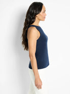 Navy blue high-neck sleeveless tank top on a model.