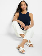 Navy high-neck tank top with a rounded crew neck and wide shoulder straps.