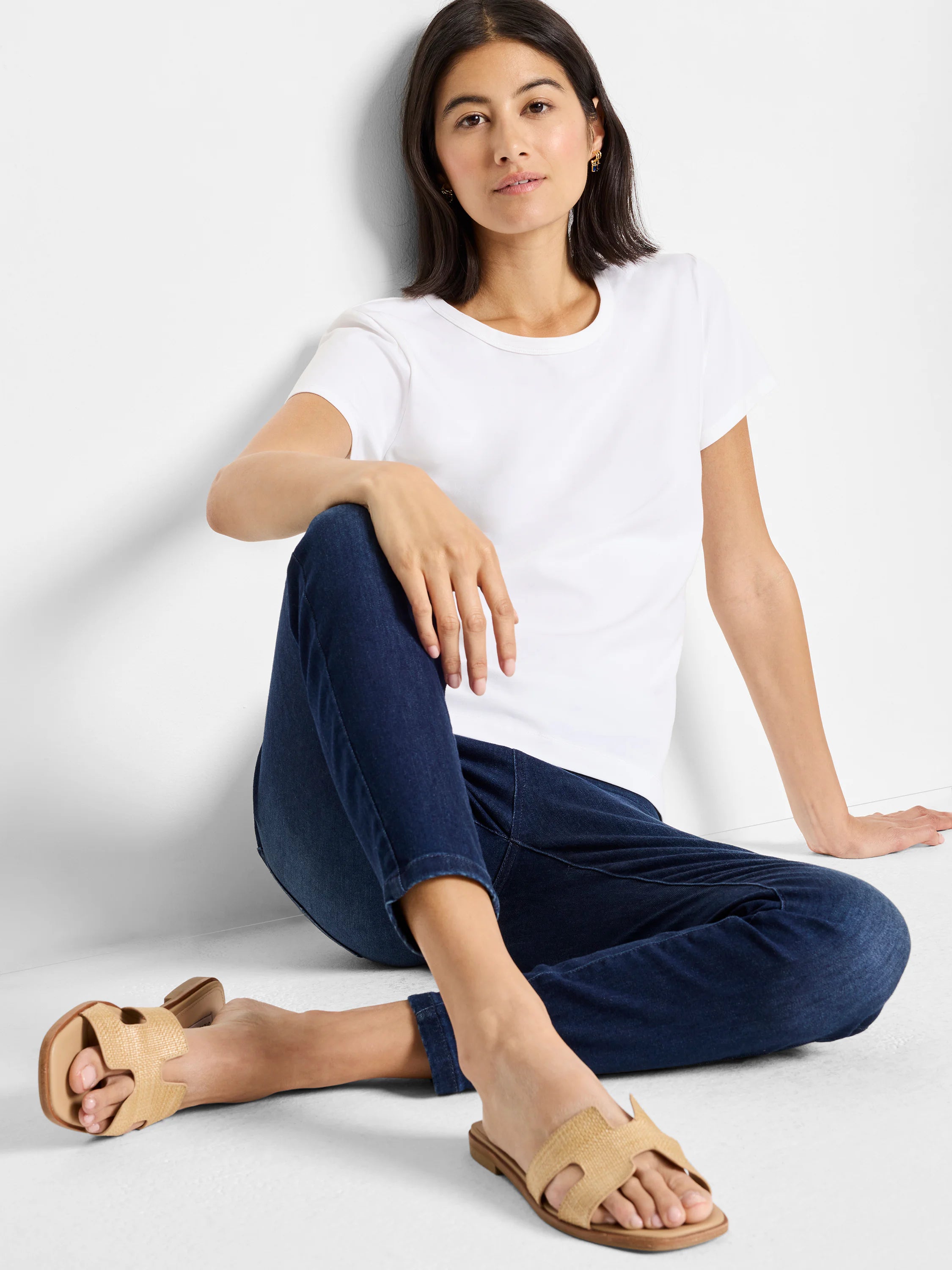 White knit crew neck t-shirt with short sleeves.