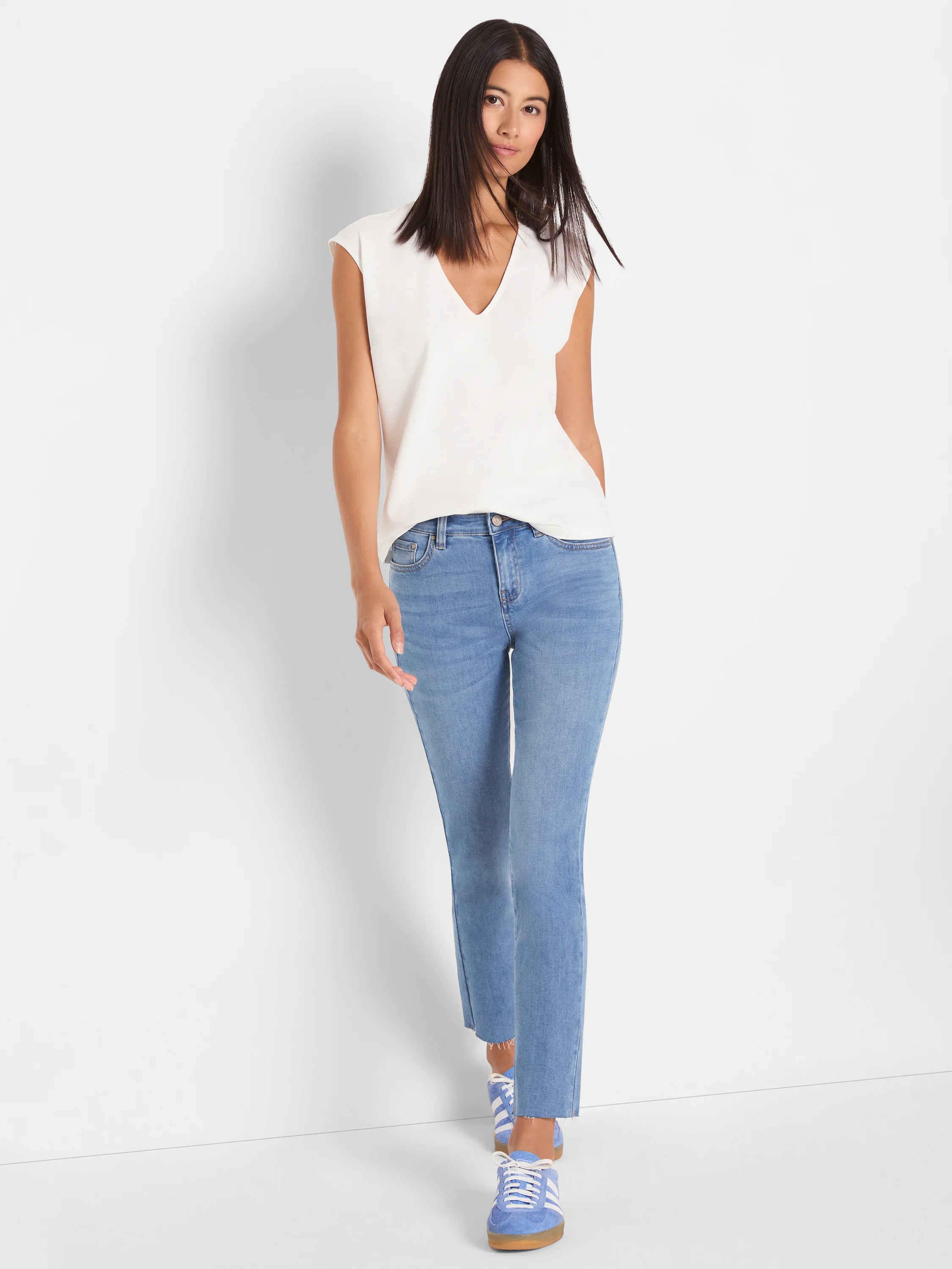 Cream V-neck top. Cap sleeves, relaxed fit.