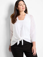 White sheer open cardigan with 3/4 ribbed sleeves, front tied at waist.