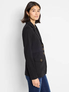 Black knit blazer with soft lapels, three gold buttons, and two front flap pockets.