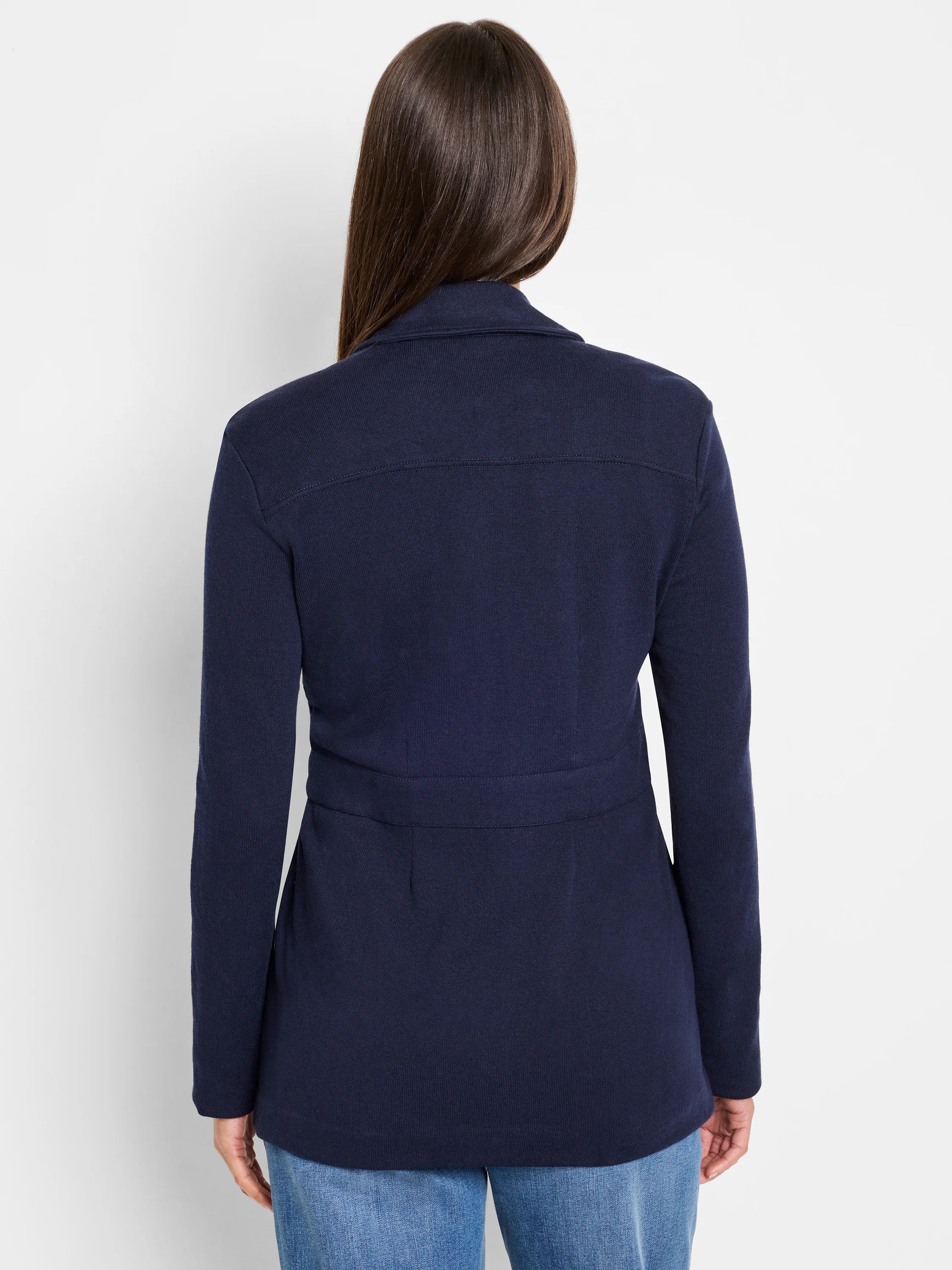 Navy knit blazer, back view. Features a back yoke seam, cinched waist band, and long sleeves.