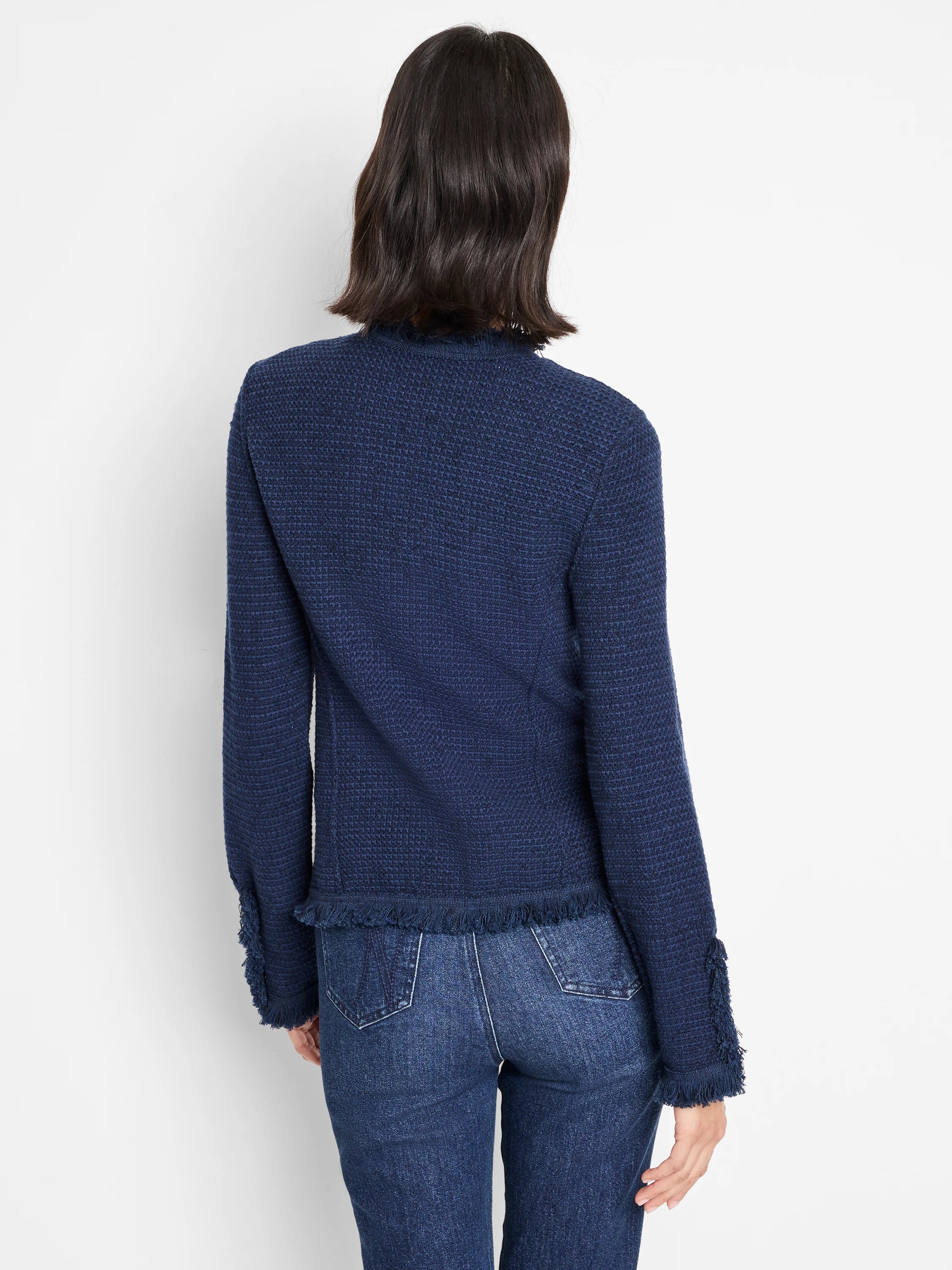 Navy blue mixed knit jacket with fringe trim at hem and cuffs, shown from behind.