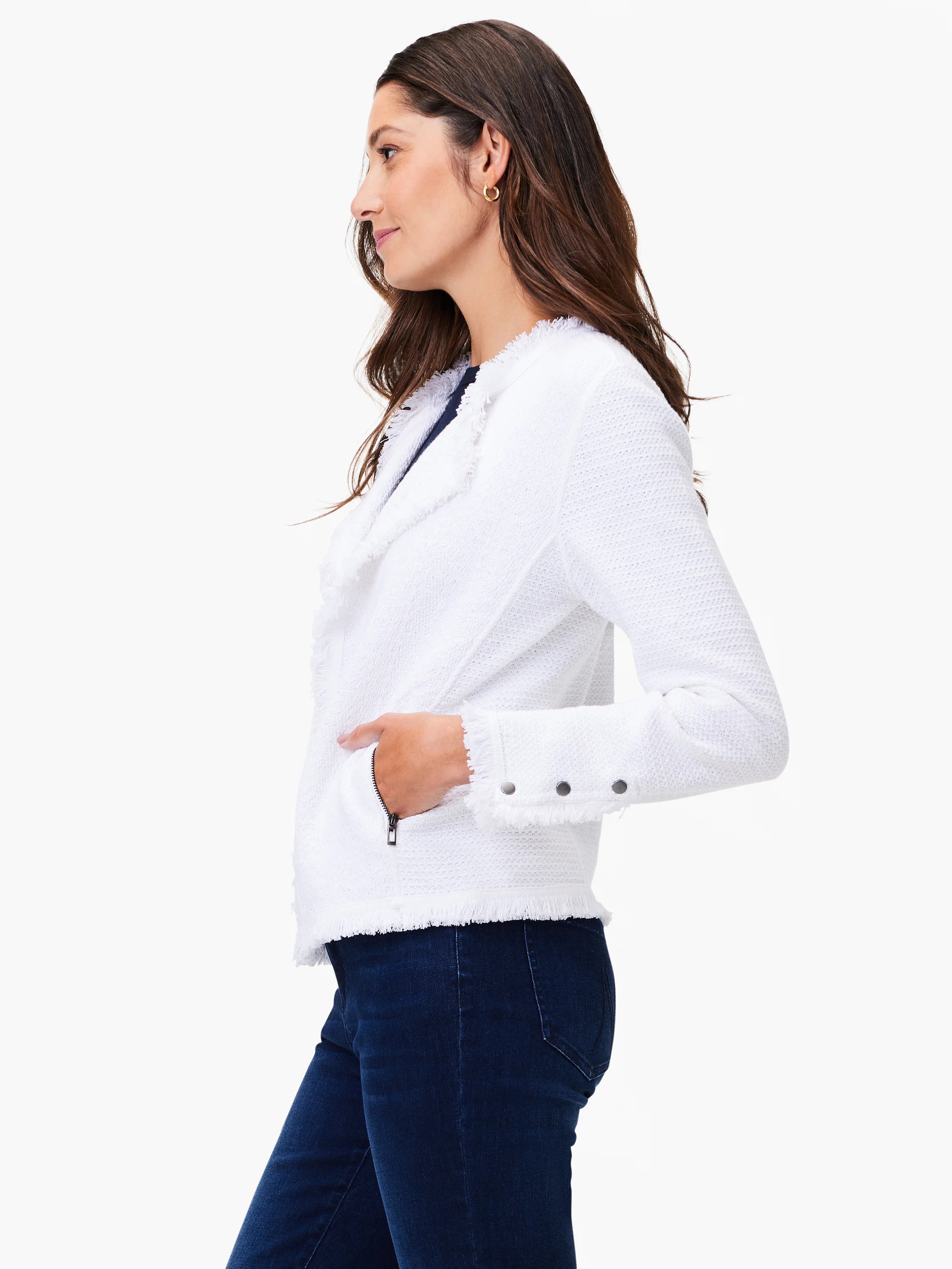 White knit jacket with fringe trim on lapel, cuffs, and hem. Features a side zipper pocket and stud details on cuffs.