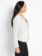Off-white mix knit jacket with black flecks, fringe trim, silver side zipper, and cuff buttons.
