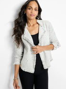 Light gray mixed knit jacket with dark flecks, featuring prominent fringe along all edges. Open-front style.