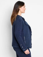 Navy textured knit jacket with fringe along open front and cuffs, silver asymmetrical zipper, and cuff buttons.
