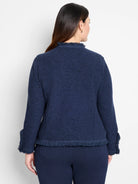 Dark blue textured knit jacket, back view. Features fringe along the collar, cuffs, and bottom hem.