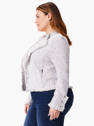 Light gray marl knit jacket with fringe on lapels, hem, and cuffs. Has a side zipper and decorative sleeve buttons.