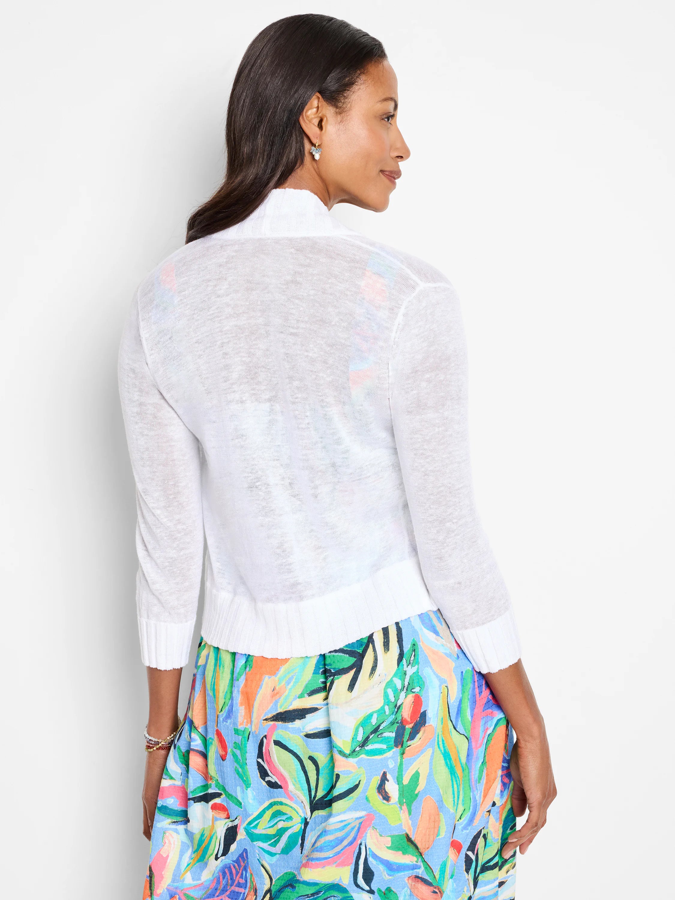 White sheer bolero cardigan with 3/4 sleeves and ribbed trim.