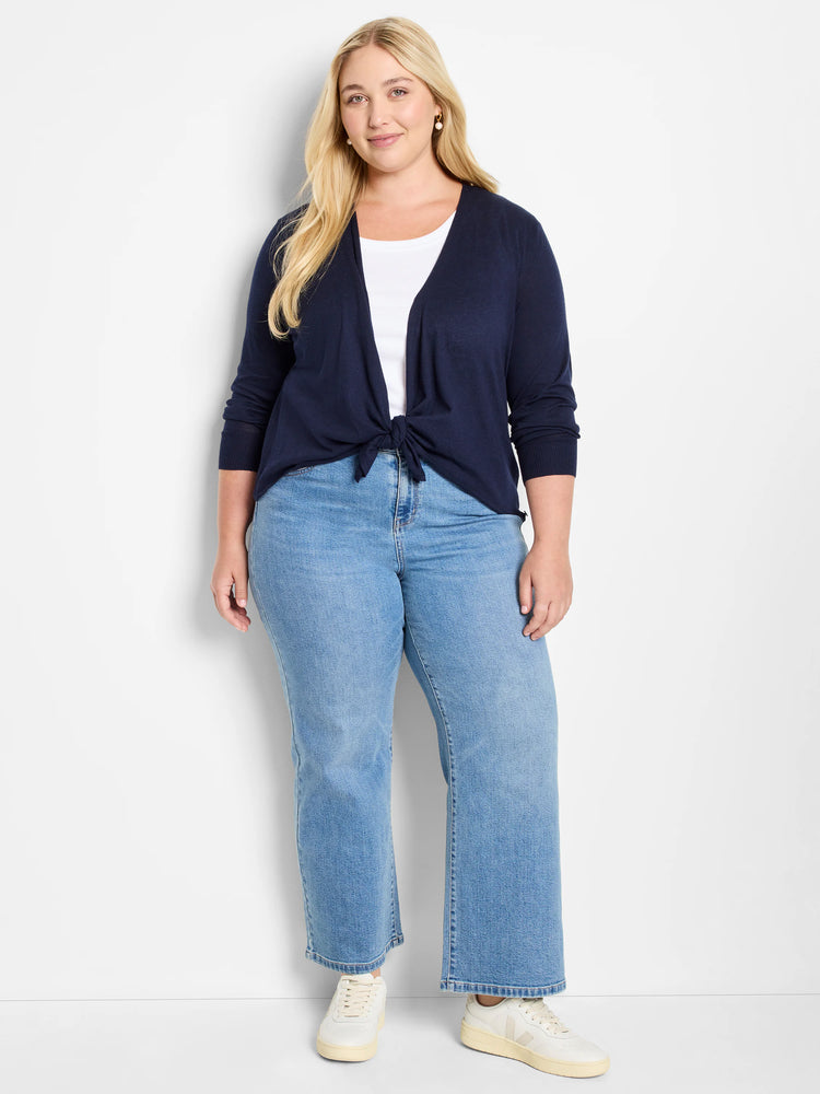 Dark navy blue cardigan, tied at the waist. Features long sleeves with ribbed cuffs.