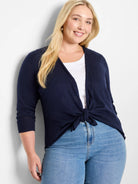 Navy 3/4 sleeve open-front cardigan, tied at the waist.
