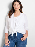 White cardigan with 3/4 length sleeves, ribbed cuffs, tied in a knot at the front.