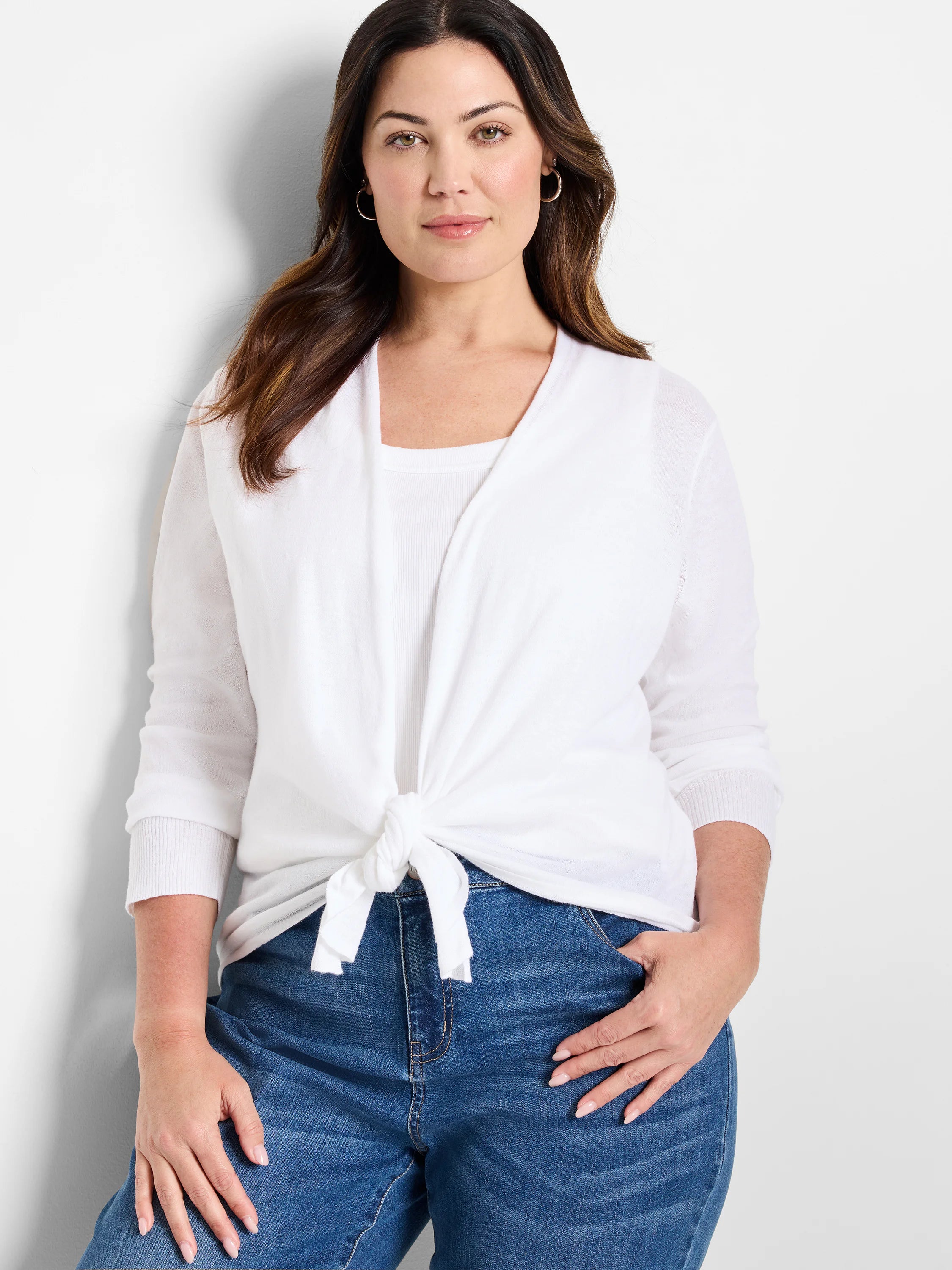 White cardigan with 3/4 length sleeves, ribbed cuffs, tied in a knot at the front.