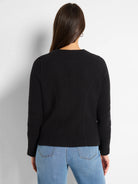 Black weave mix knit jacket, seen from behind, features a rounded neck and curved back seams.