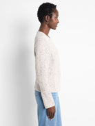 Light cream weave mix knit jacket with dark flecks, shown from the side.