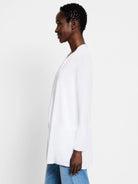 White open-front cardigan, long sleeves, hip-length.