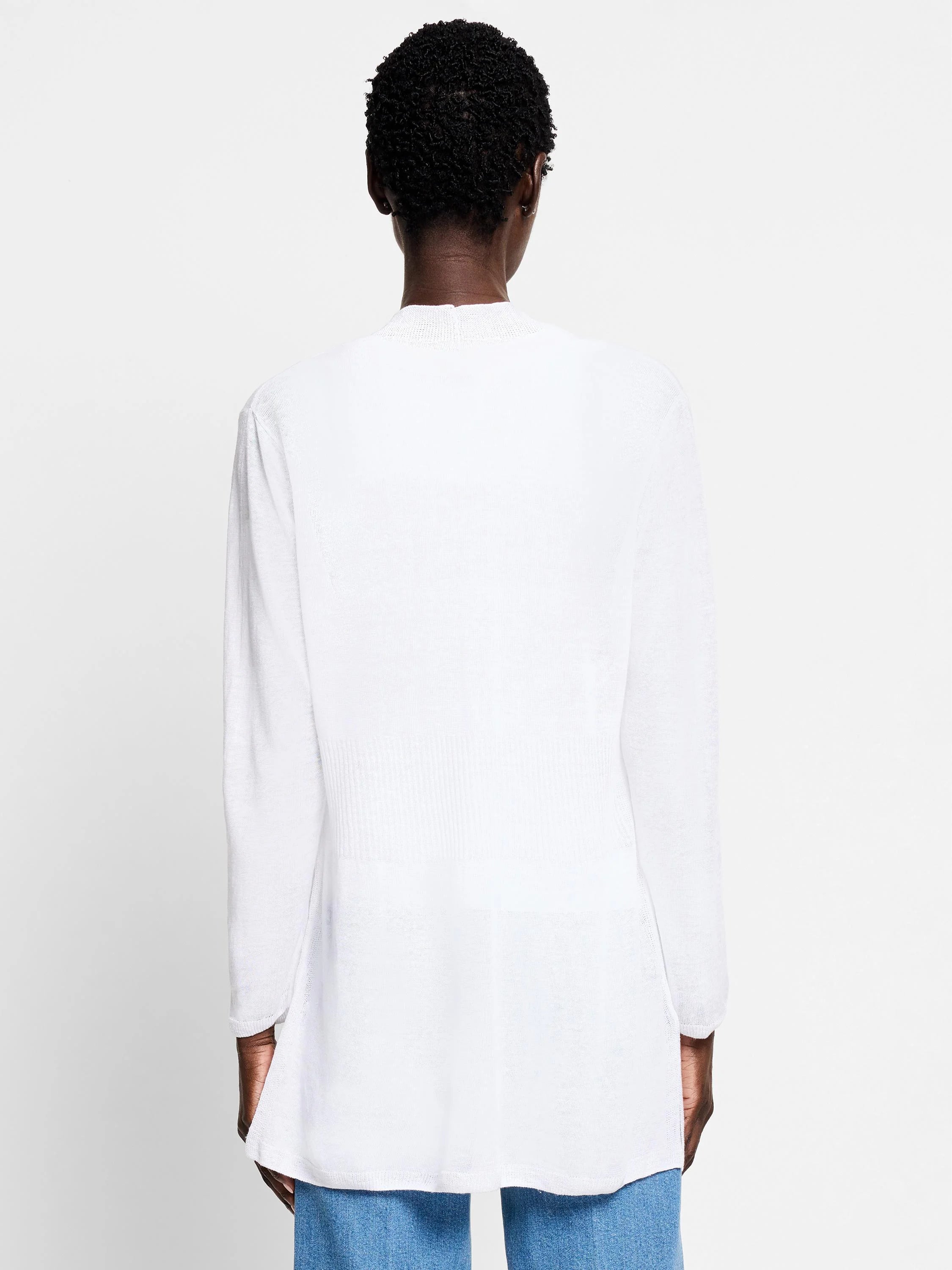 White long-sleeve cardigan, hip-length, slightly fitted at waist.  Rear view.
