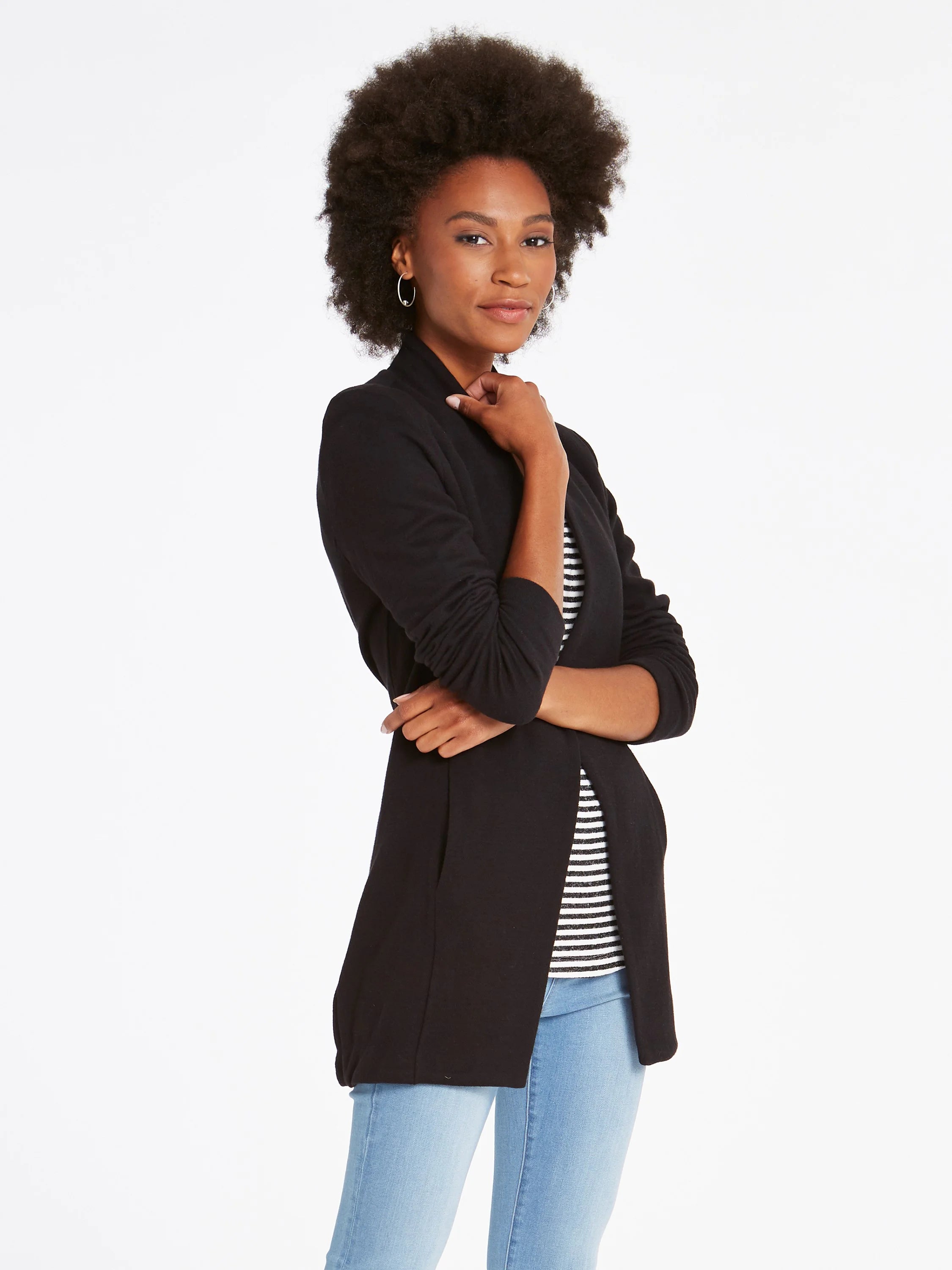 Black open knit jacket with long sleeves and a slightly longer back hem.