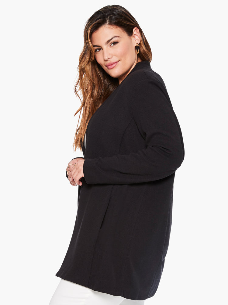 Black longline knit jacket with long sleeves and a relaxed fit.