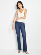 Off-white cami tank with thin straps and matching lace trim along the V-neckline.