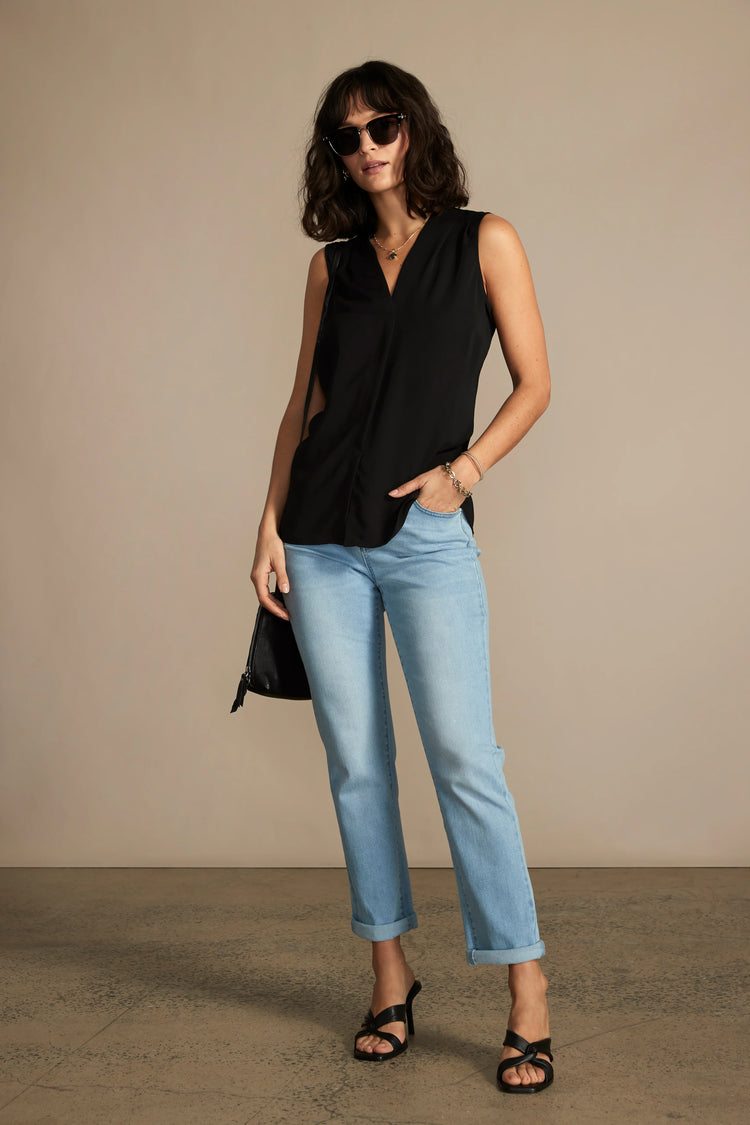 Black sleeveless V-neck top shown on model.