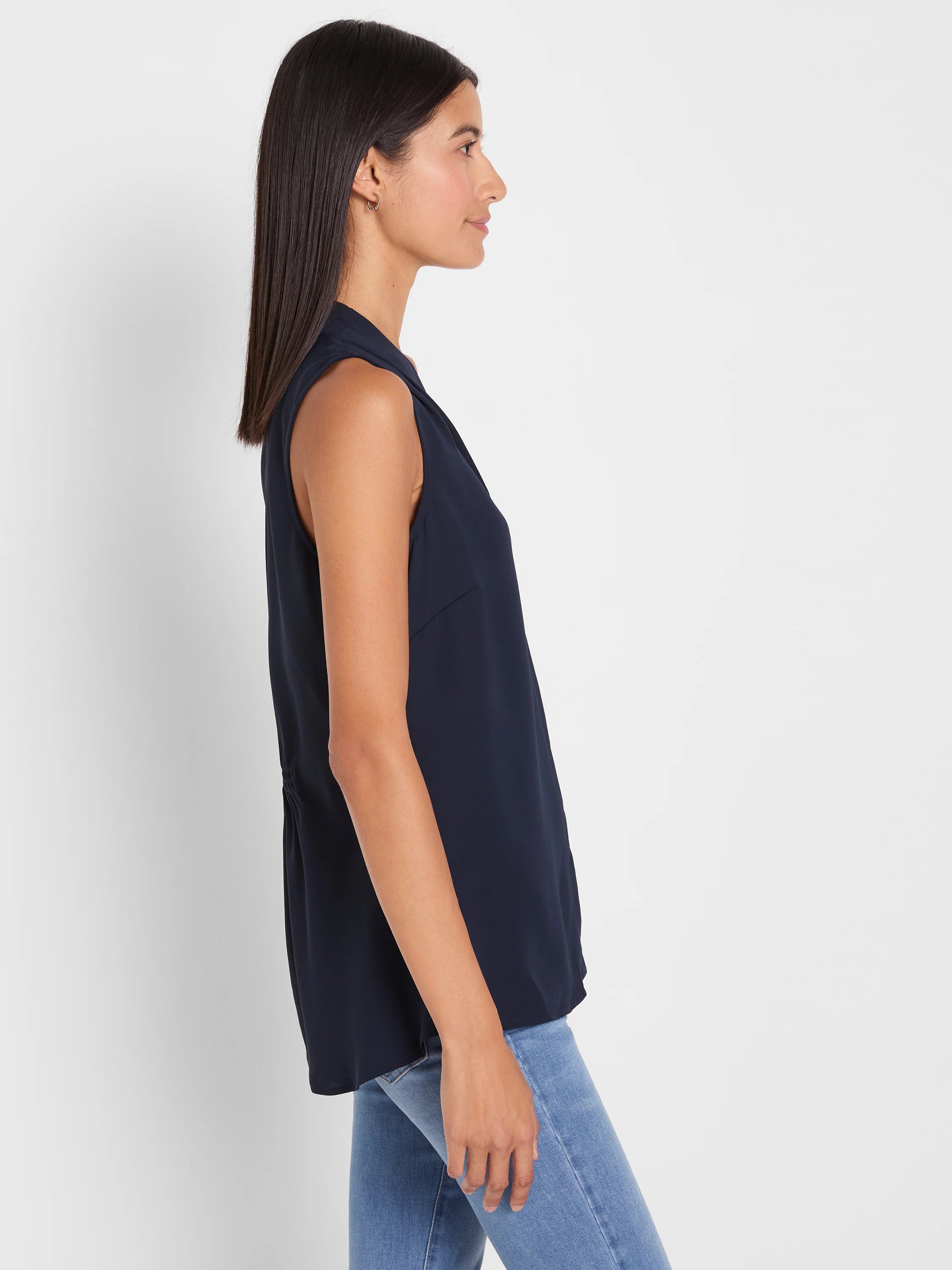 Dark navy blue sleeveless top with a draped V-neck, relaxed fit, and gathered side detail.