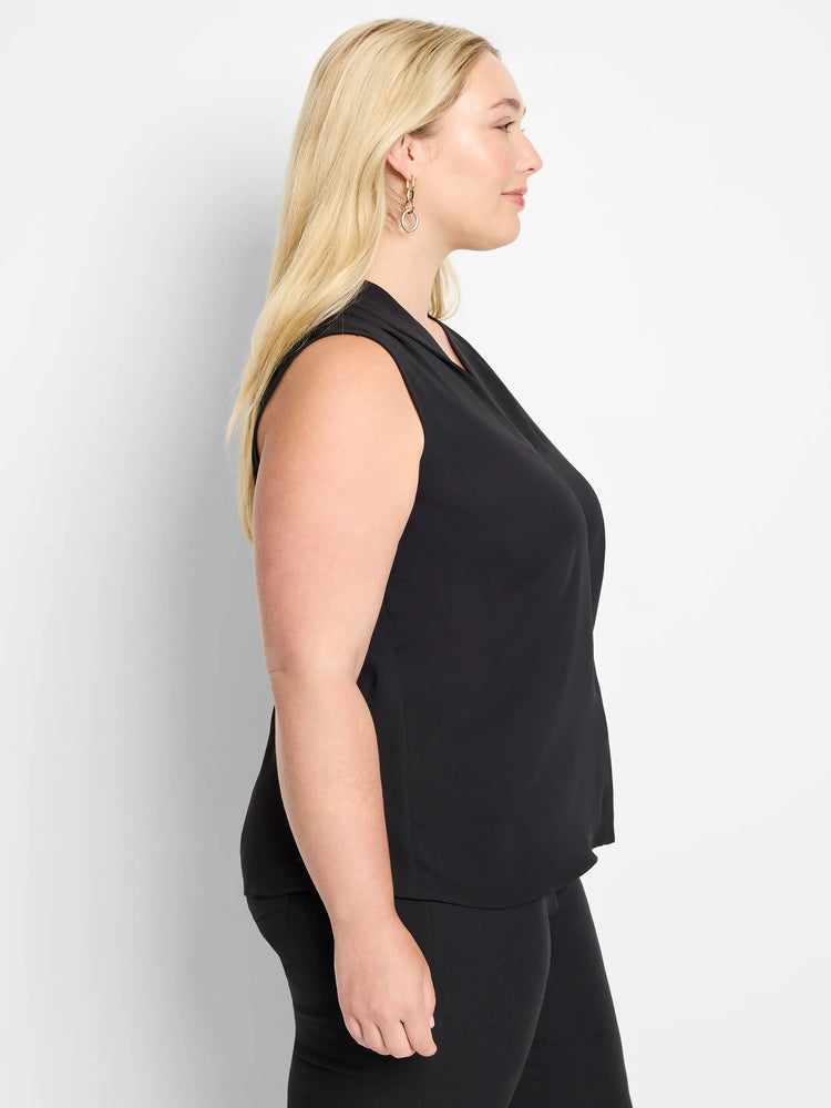 Black sleeveless top with a draped V-neck, worn by a model facing right.