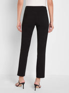 Rear view of black straight-leg trousers. High-waisted with a smooth waistband, two stitched back patch pockets, and a...