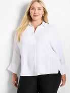 White collared V-neck blouse with 3/4 wide sleeves, side slits, and a relaxed fit.