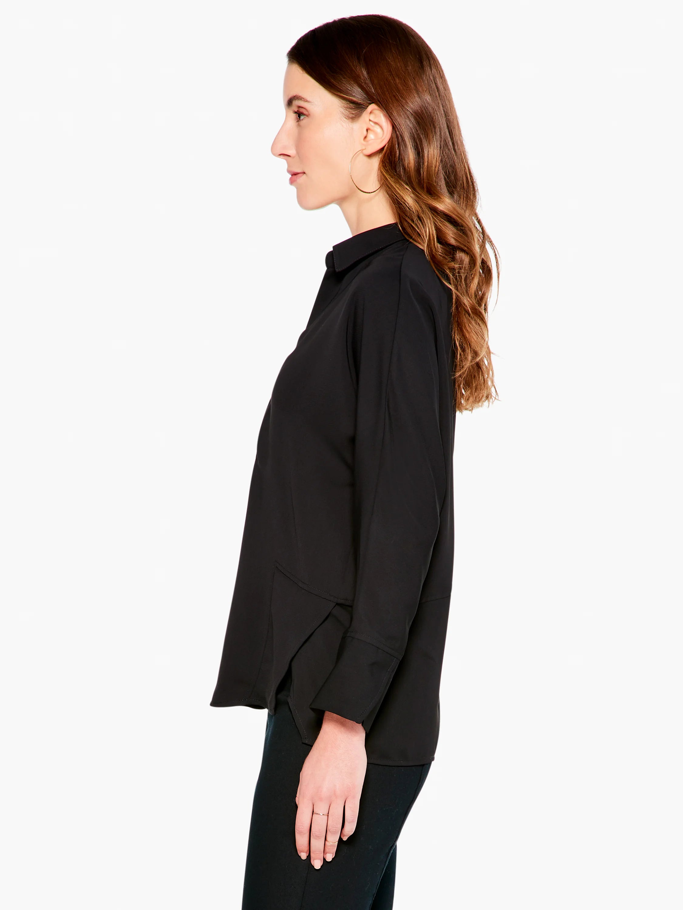 Black, collared, long-sleeve blouse; asymmetrical hemline.