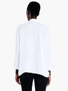 Here's alt text that meets the requirements:

"White, long-sleeve blouse, asymmetrical hemline, shown from the back.