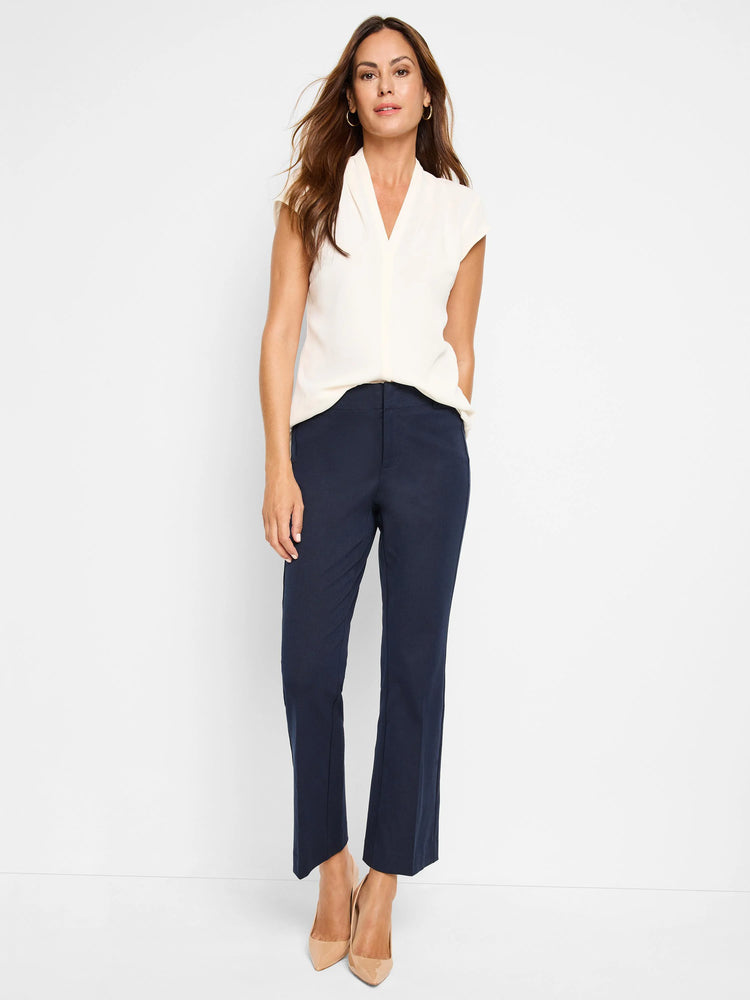 Cream cap sleeve V-neck blouse, loose-fitting.