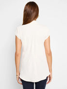 Cream cap sleeve top, back view, with waist shirring and a curved hem.