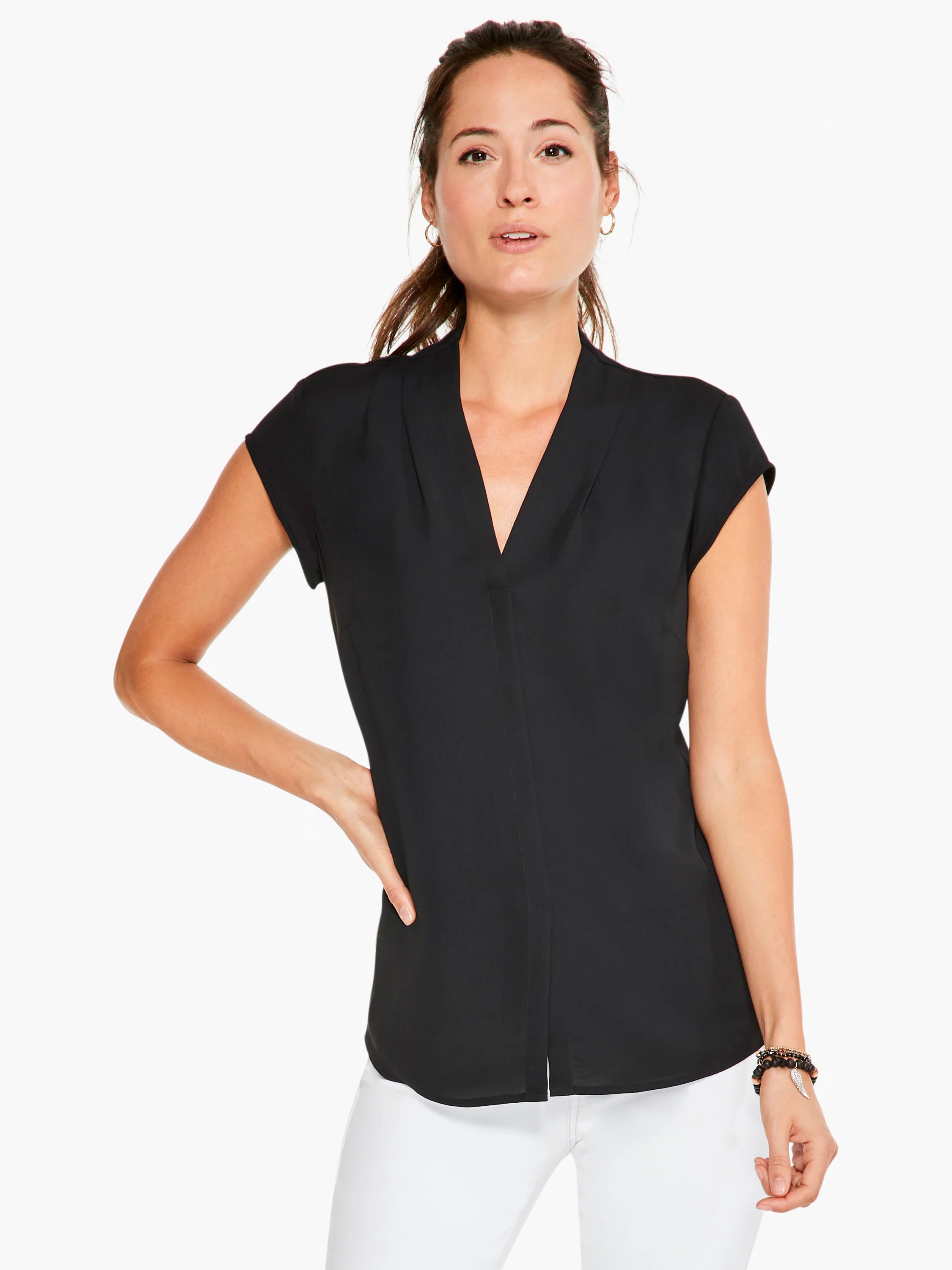 Black cap-sleeve top, V-neck, center seam.