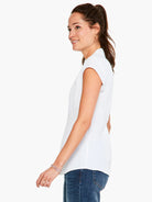 White cap-sleeve top, fitted silhouette.