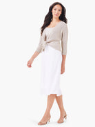 White linen slip skirt with a smooth drape, straight cut, and midi length.