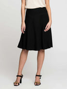 Black A-line skirt with a wide waistband, flared silhouette, and knee-length hem.
