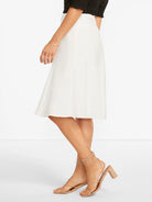 White A-line midi skirt with a textured linen-blend fabric.