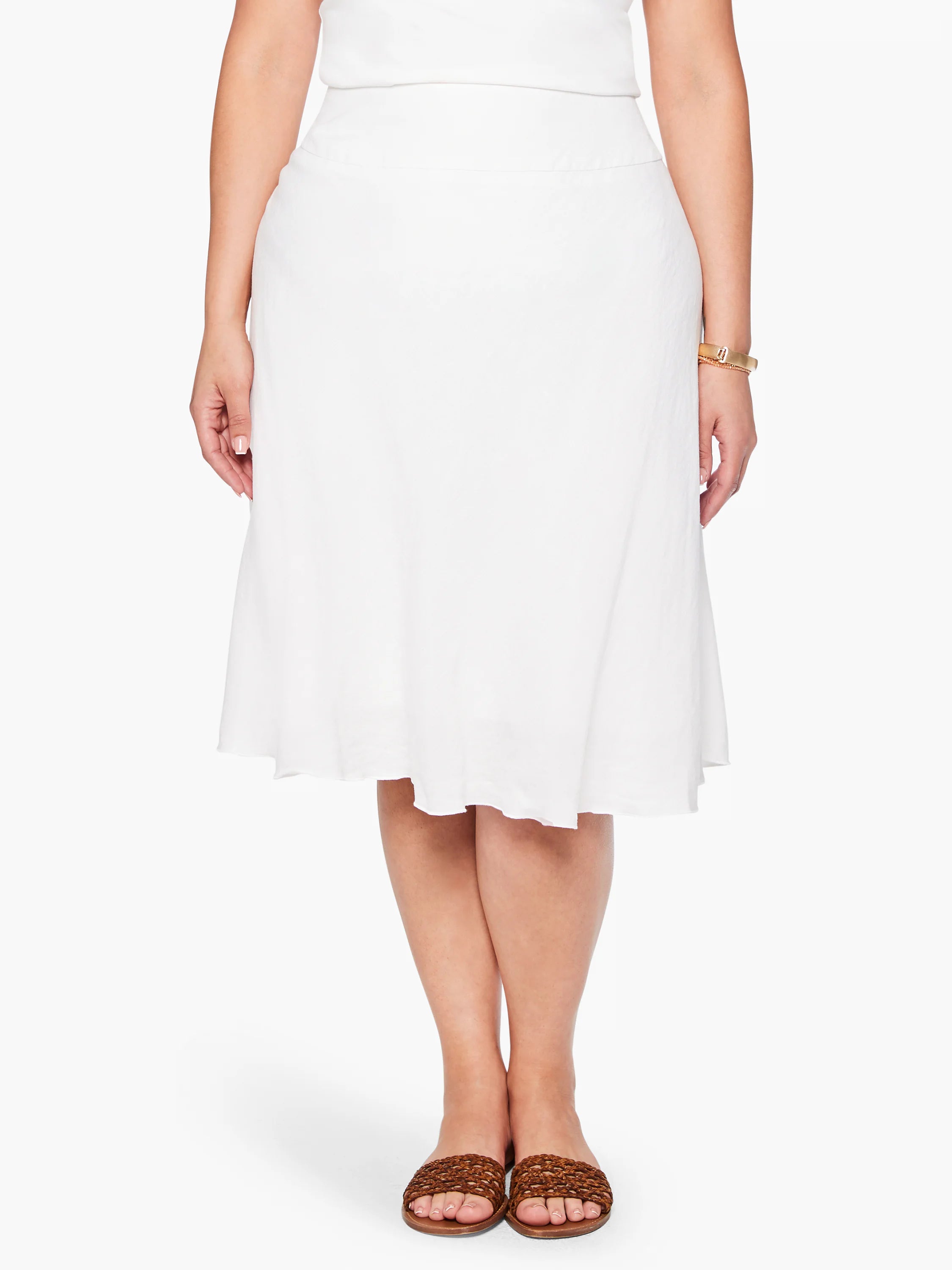 White A-line midi skirt with textured fabric, flat waistband, and subtle flare.