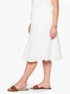 White A-line skirt with a flared hem, hitting below the knee.